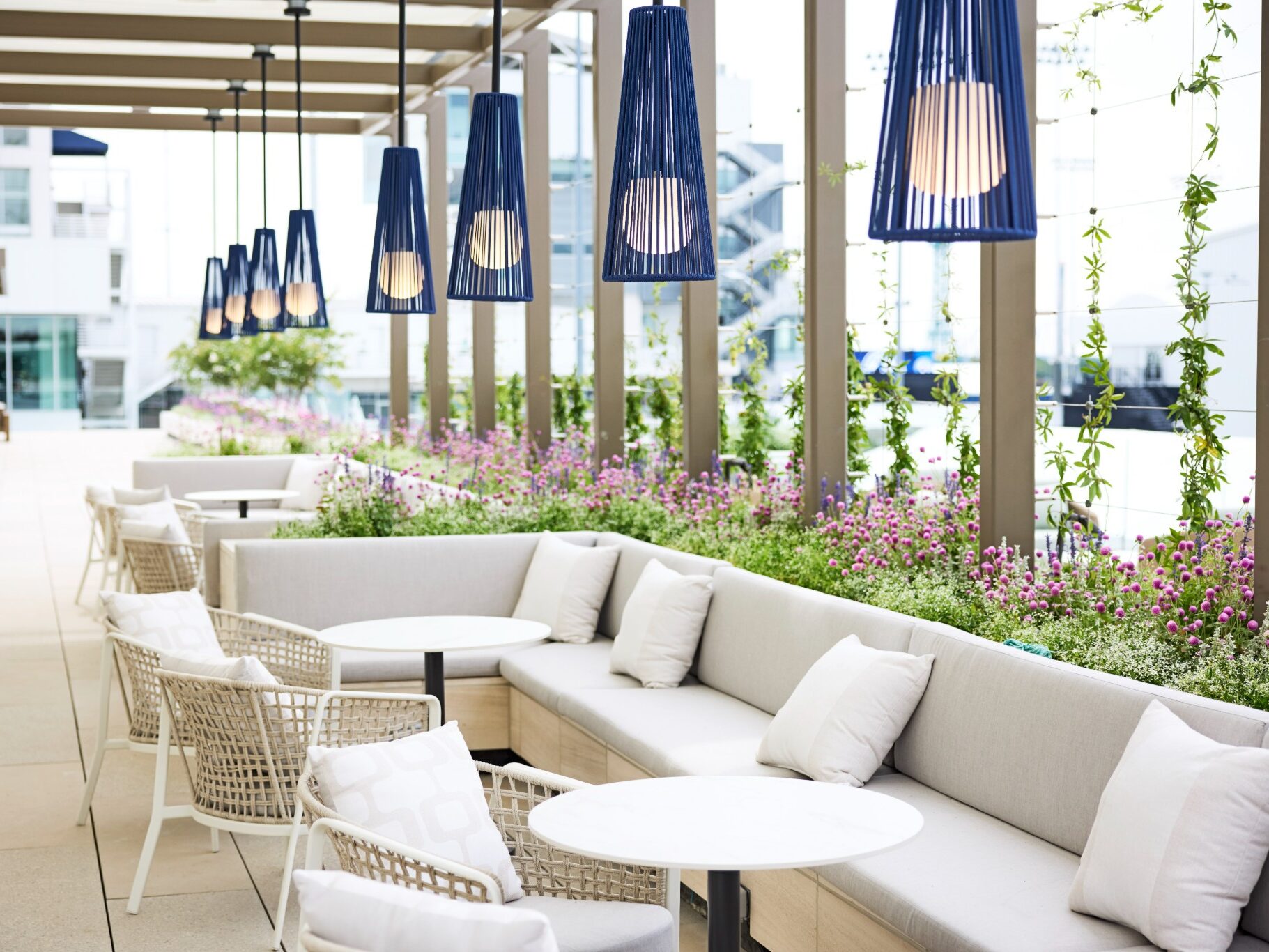 outdoor lounge seating with beige couches and chairs