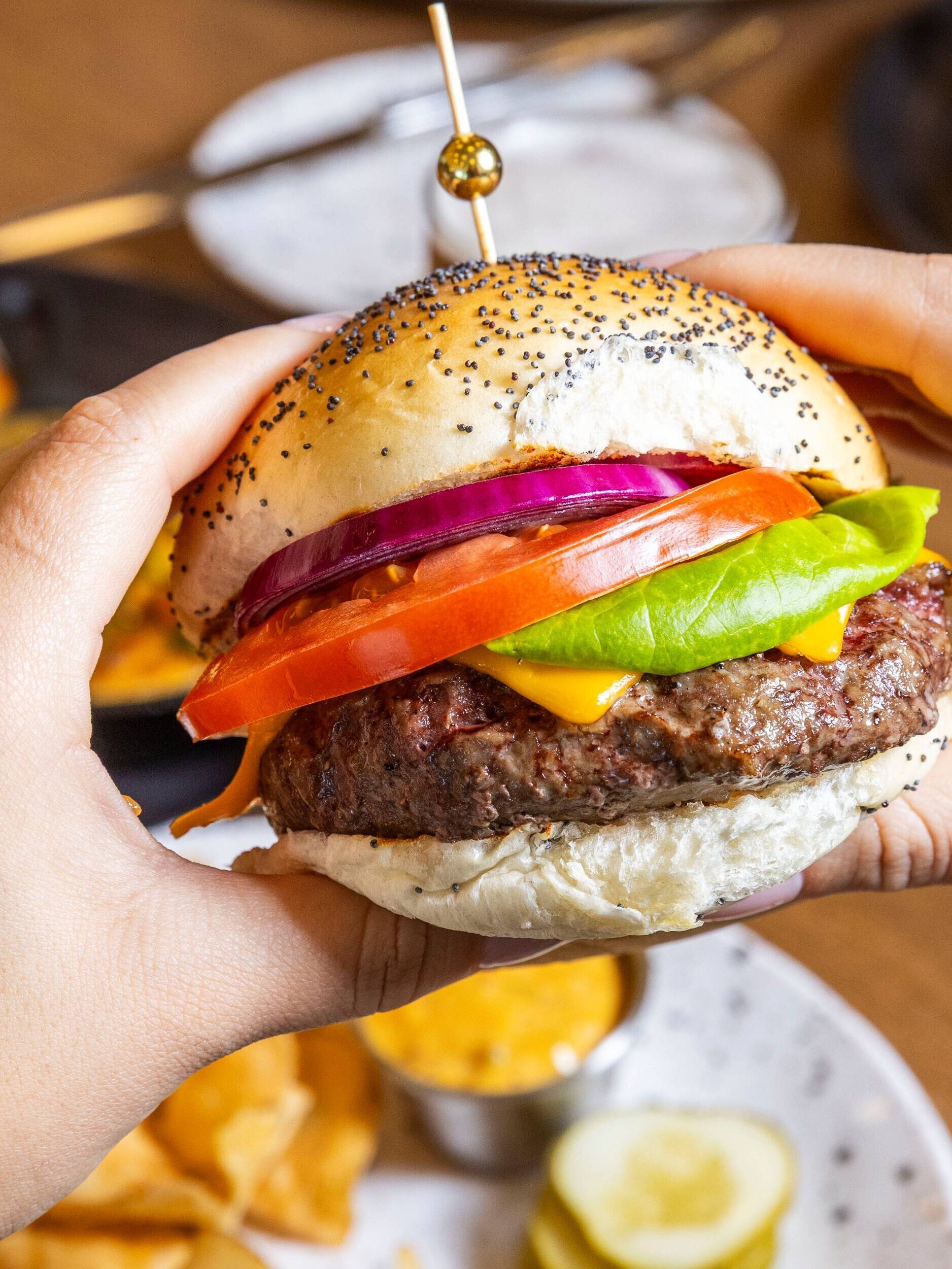 Women holding a burger